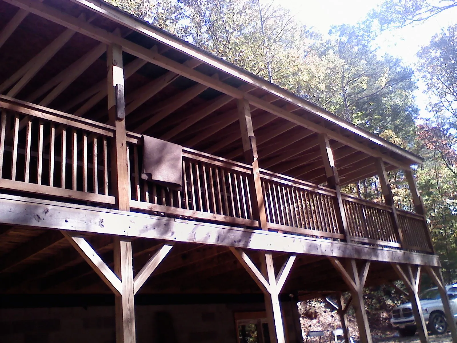 Timber framing under a new elevated porch and deck — Roof Leak Repair in Kansas by Roofing Brothers